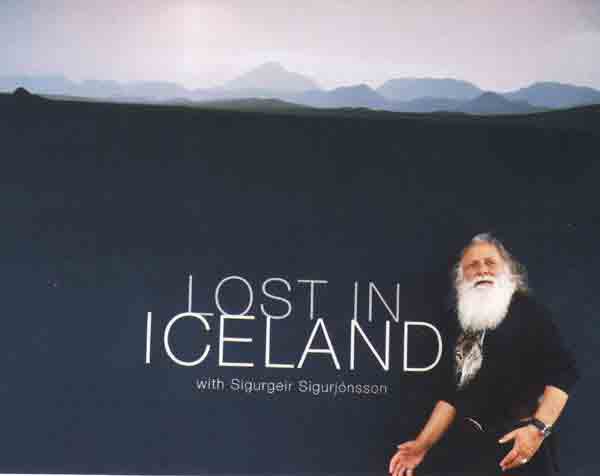Francis posing in front of the poster - Lost in Iceland